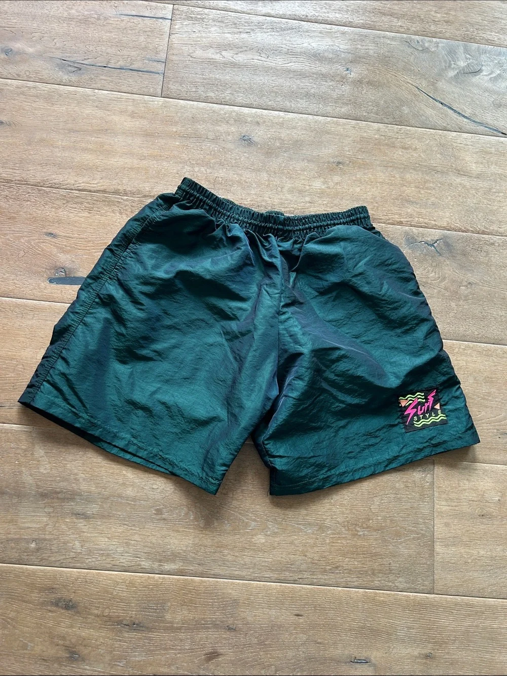 surf style Men's Athletic Shorts in Dark Green with Neon Pink Patch